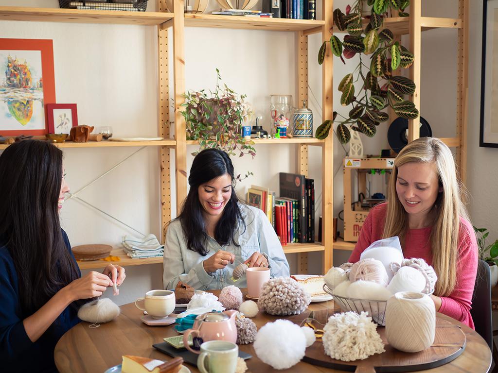 Person crafting in a cozy setting