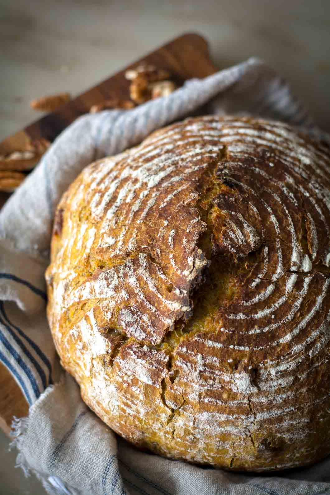 a rustic kitchen with ingredients for pumpkin bread laid out on the counter