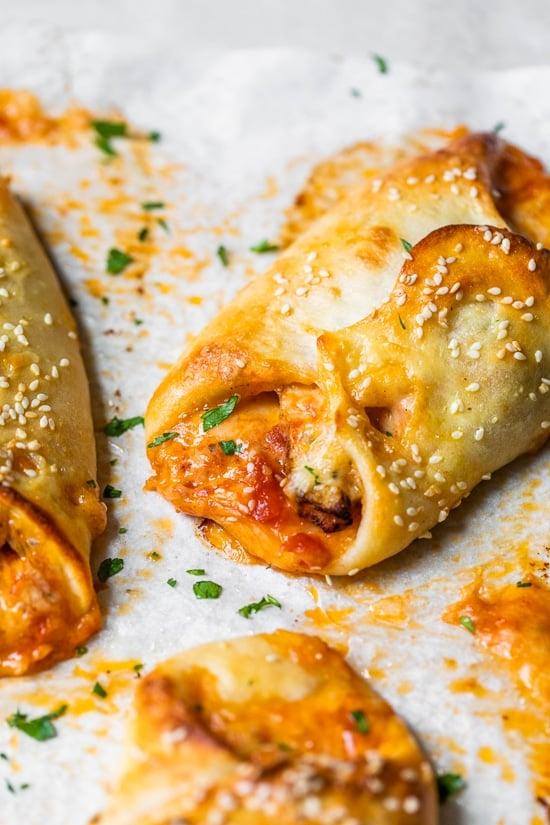 a tray of freshly baked chicken parmesan pizza rolls