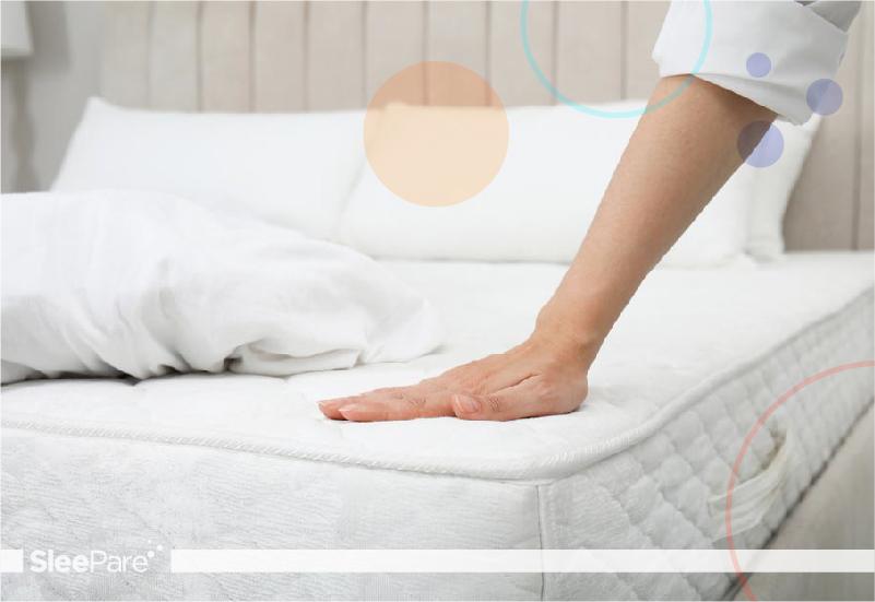 woman testing firmness of smart mattress
