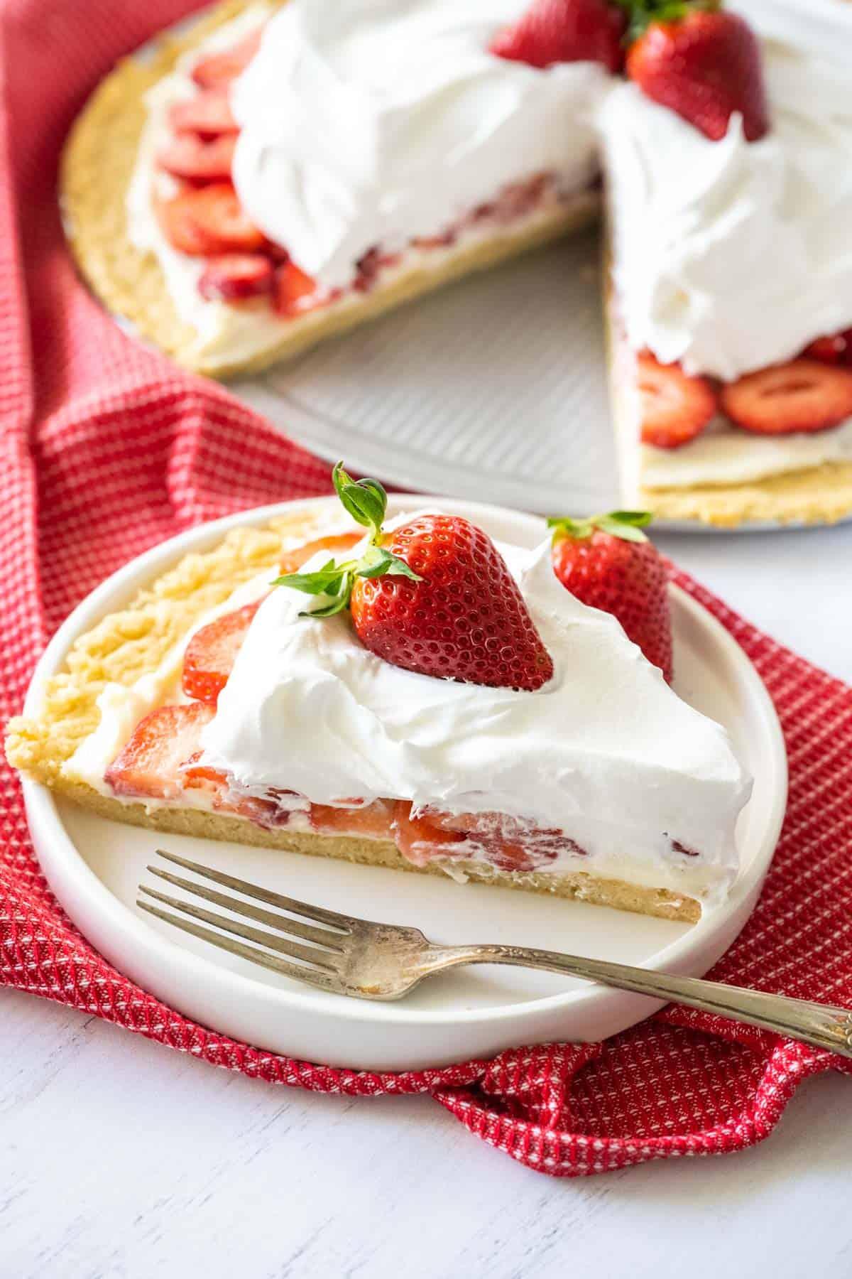 Close-up shot of sliced Blackberry Strawberry Shortcake Pizza showing layers