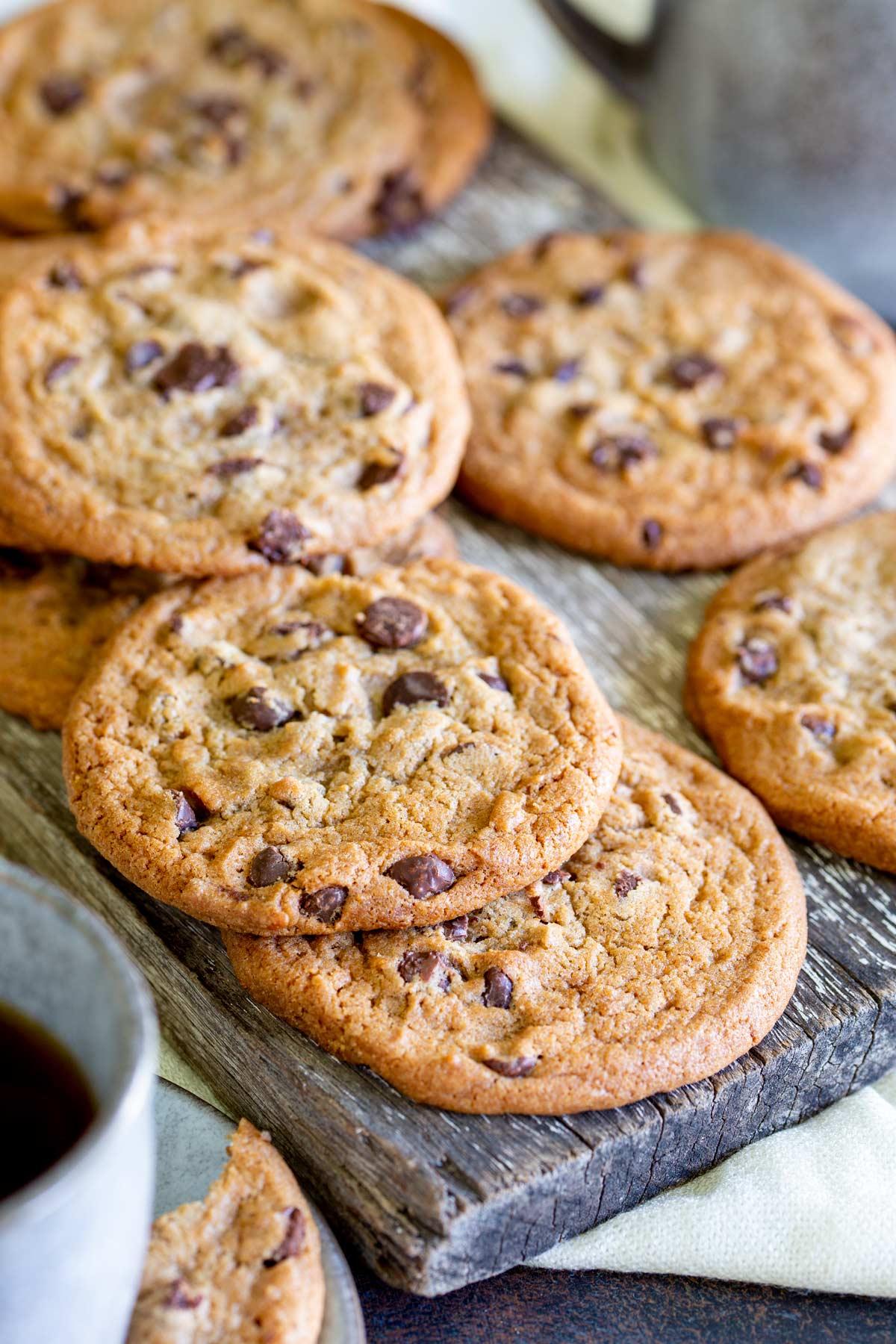ingredients for chocolate chip cookies arranged on a wooden countertop