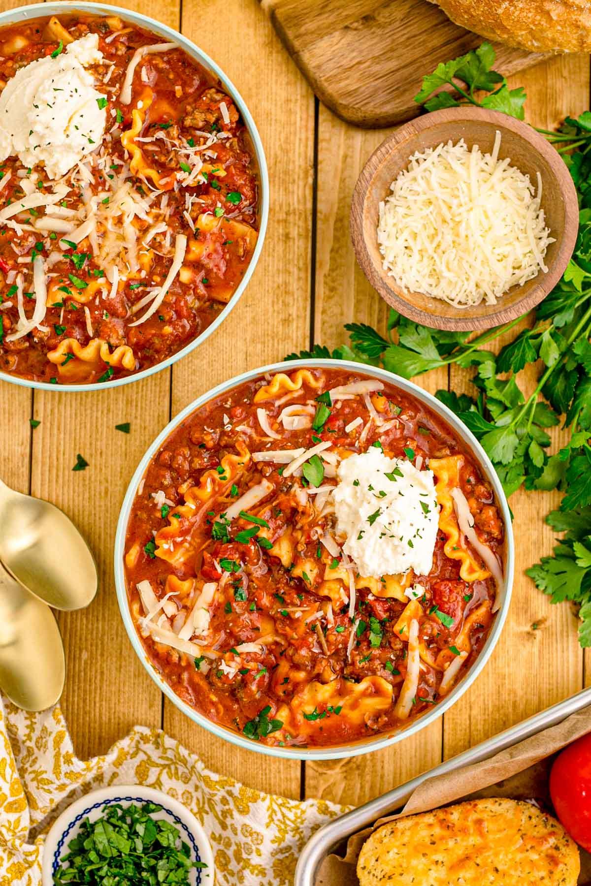 close up shot of lasagna soup ingredients on a wooden table