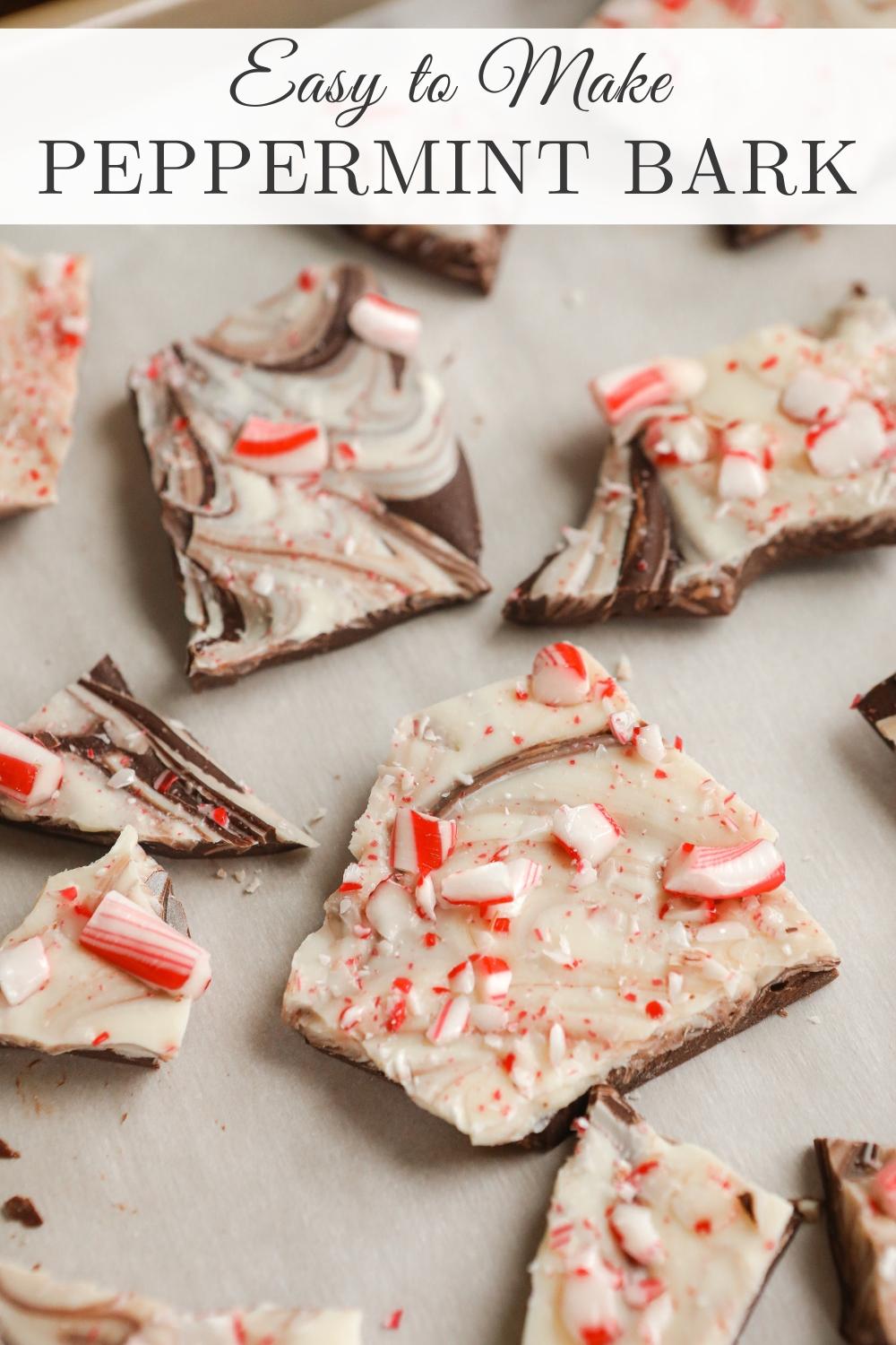 someone swirling melted white and dark chocolate on parchment paper with a toothpick