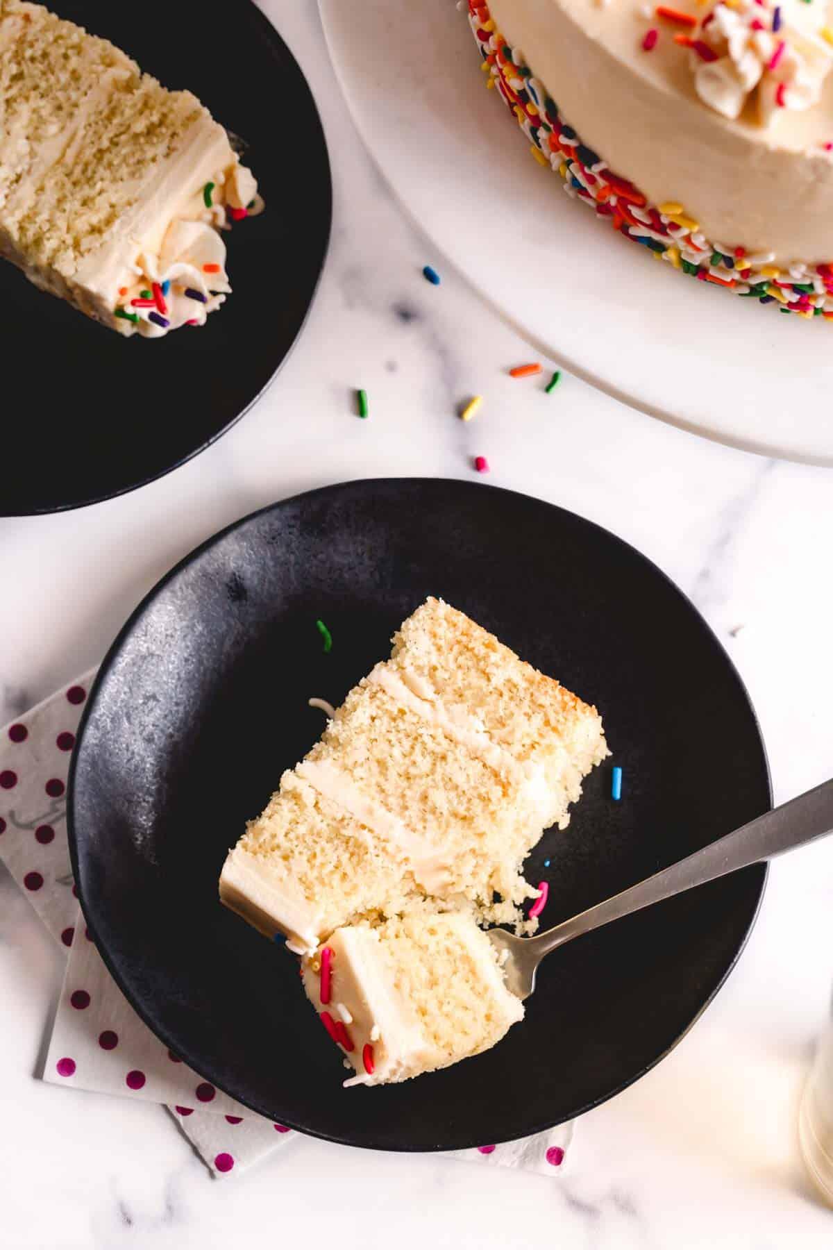 slices of vanilla cake with nigella seeds on a plate