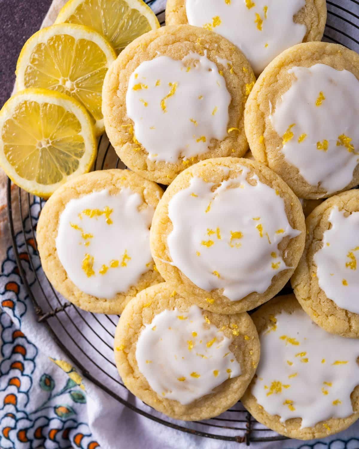 freshly baked sugar cookies with lemon glaze and fresh lemon slices
