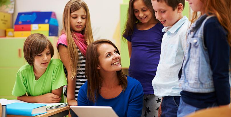 Happy teachers and students together