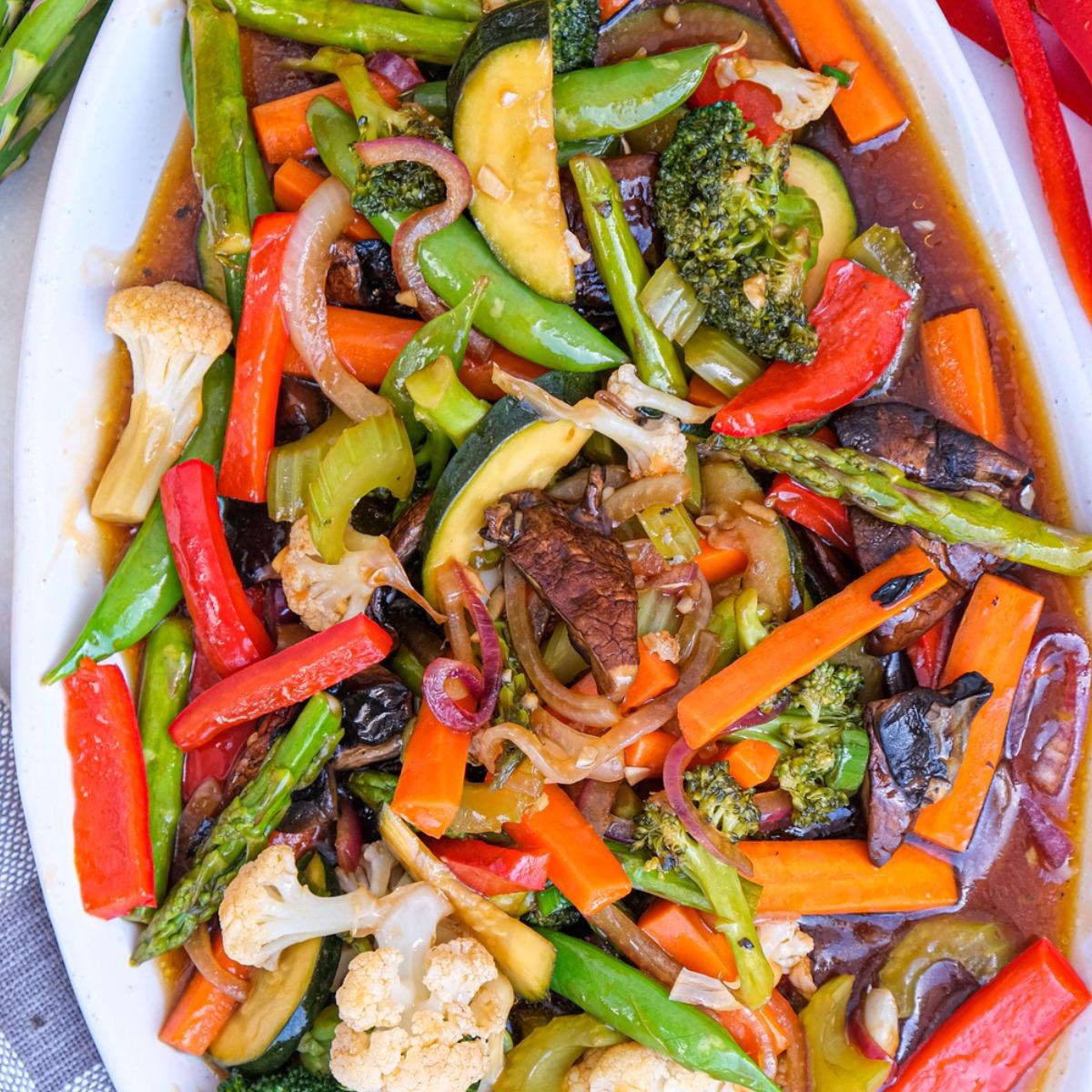 Busy kitchen counter with fresh, chopped vegetables ready for stir-fry