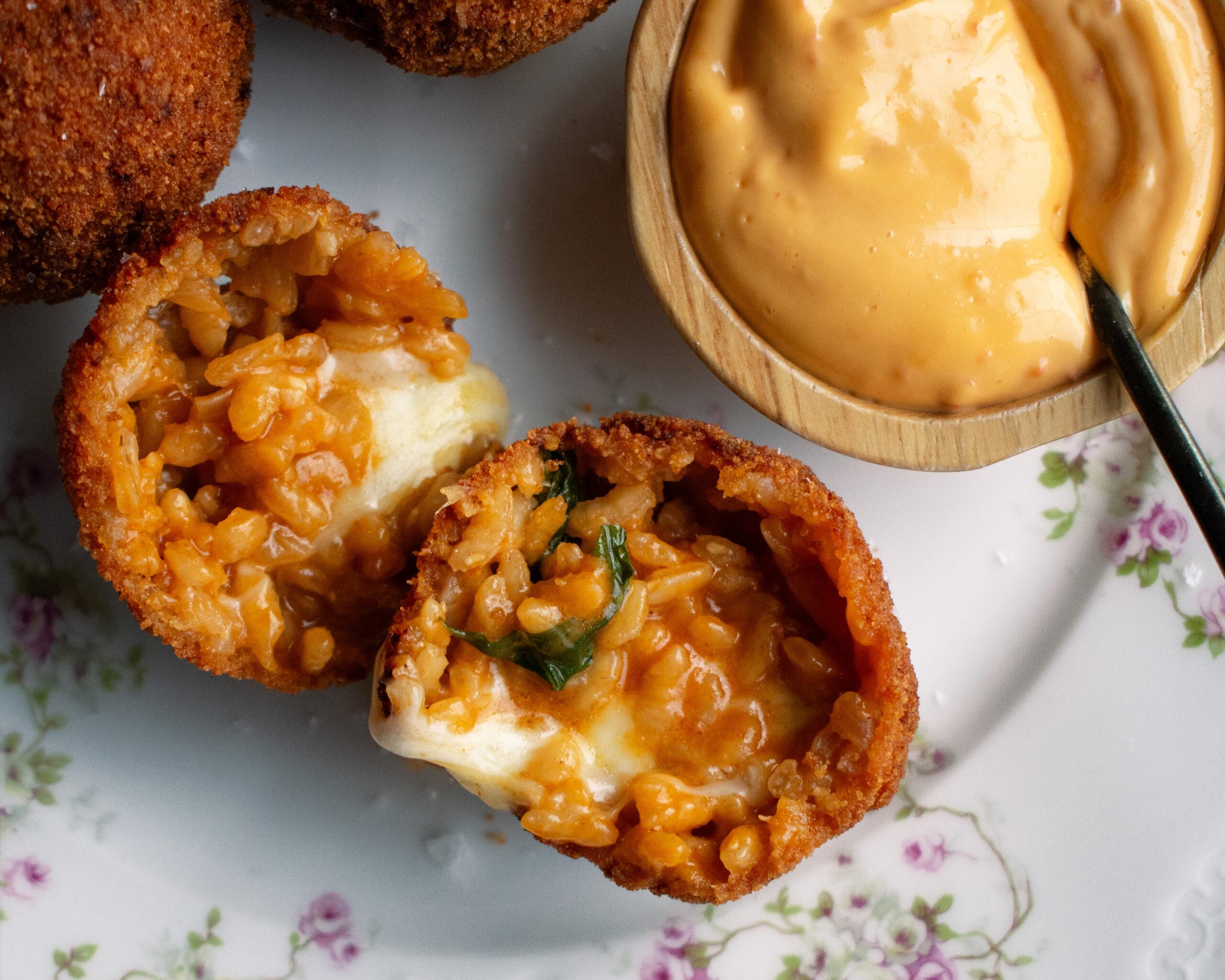 golden brown calabrian arancini rice balls