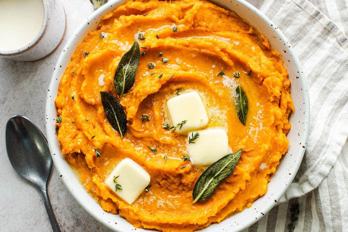 Overhead shot of creamy mashed sweet potatoes in a baking dish