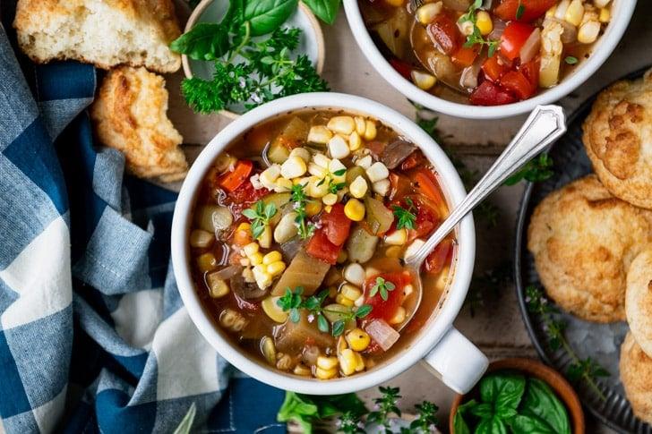 overhead shot of soup pot simmering with various vegetables
