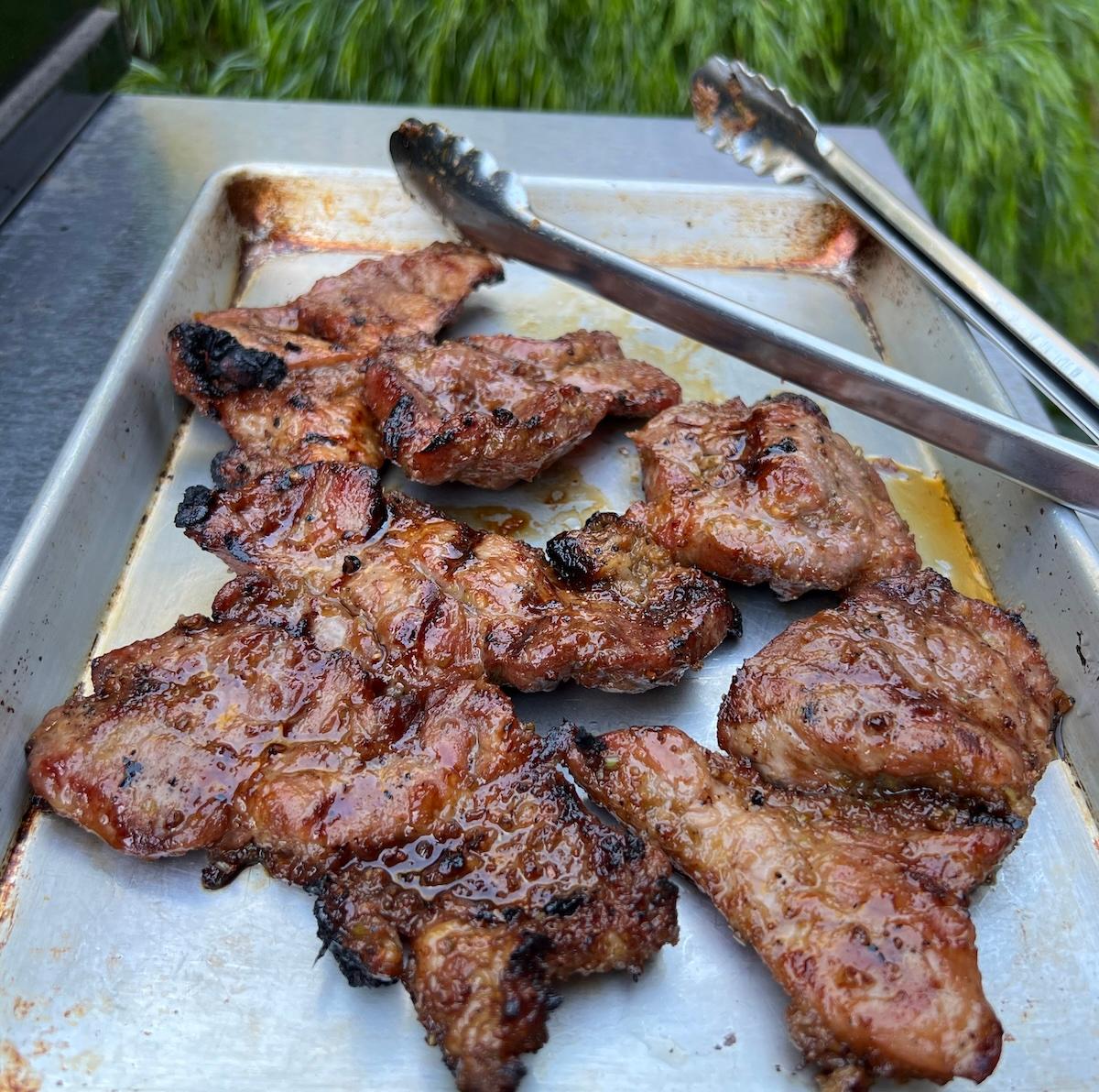 close up of grilled lemongrass bbq pork slices