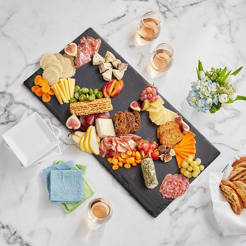 Several pieces of quince protein tang arranged artfully on a wooden board