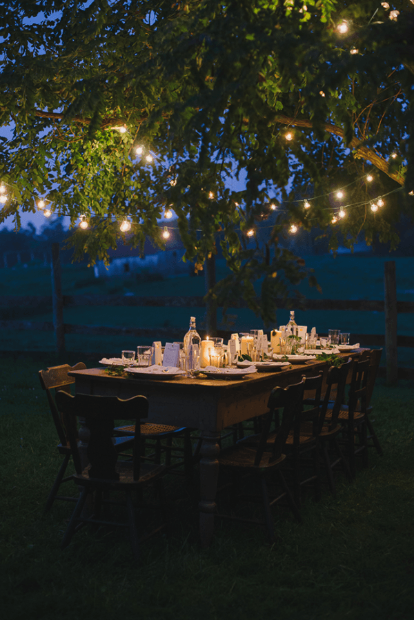 Travel party decorations with both string lights and candles