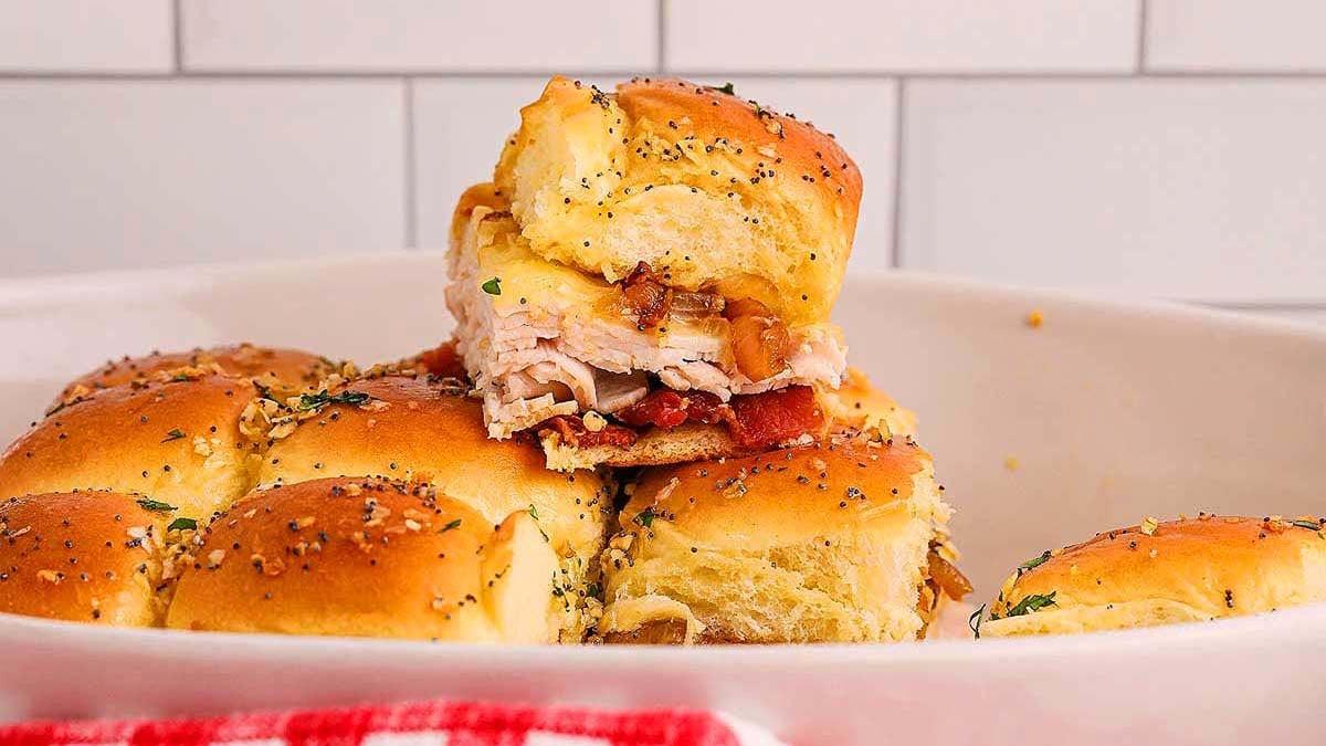 Overhead shot of several Maple Bourbon BBQ Turkey Sliders arranged on a plate