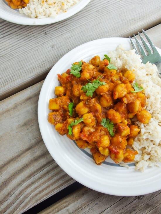Bowl of chickpea curry with warm lighting, close-up shot