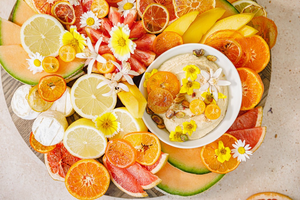 vibrant citrus fruit tray with various types of oranges, grapefruits, and lemons