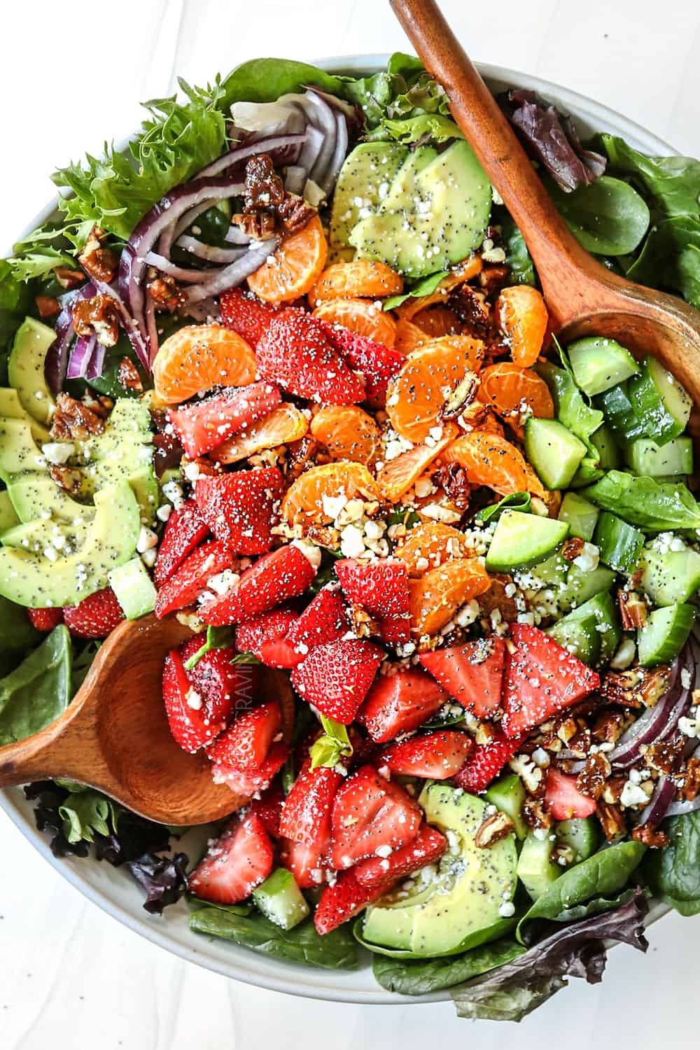 vibrant strawberry spinach salad with pineapple chunks and poppy seed dressing