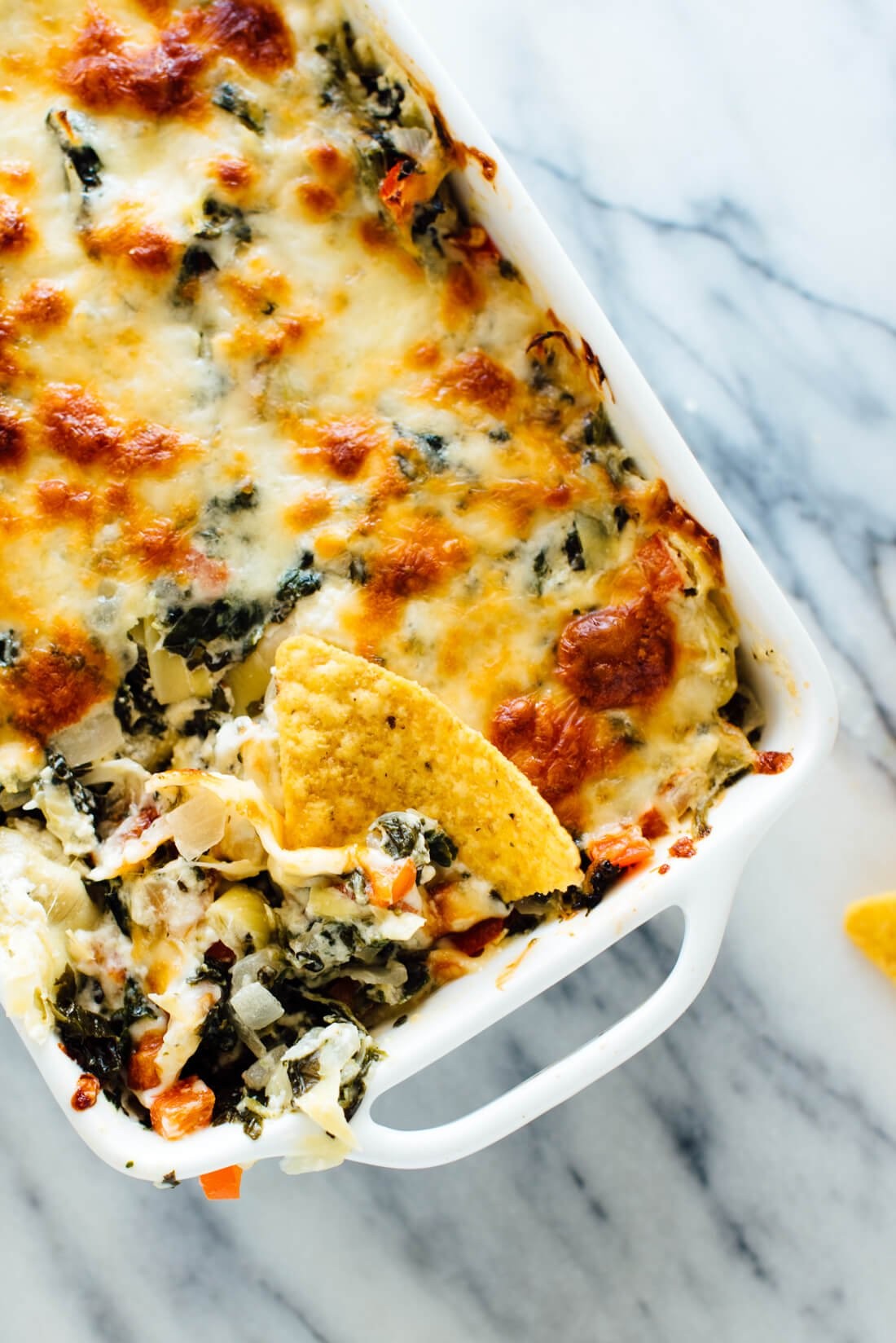 baked spinach artichoke zucchini dish fresh from the oven