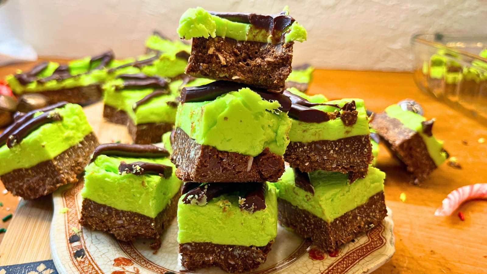vibrant green and chocolate layered mint chocolate squares, perfectly sliced, on a cooling rack, sunlight, refreshing