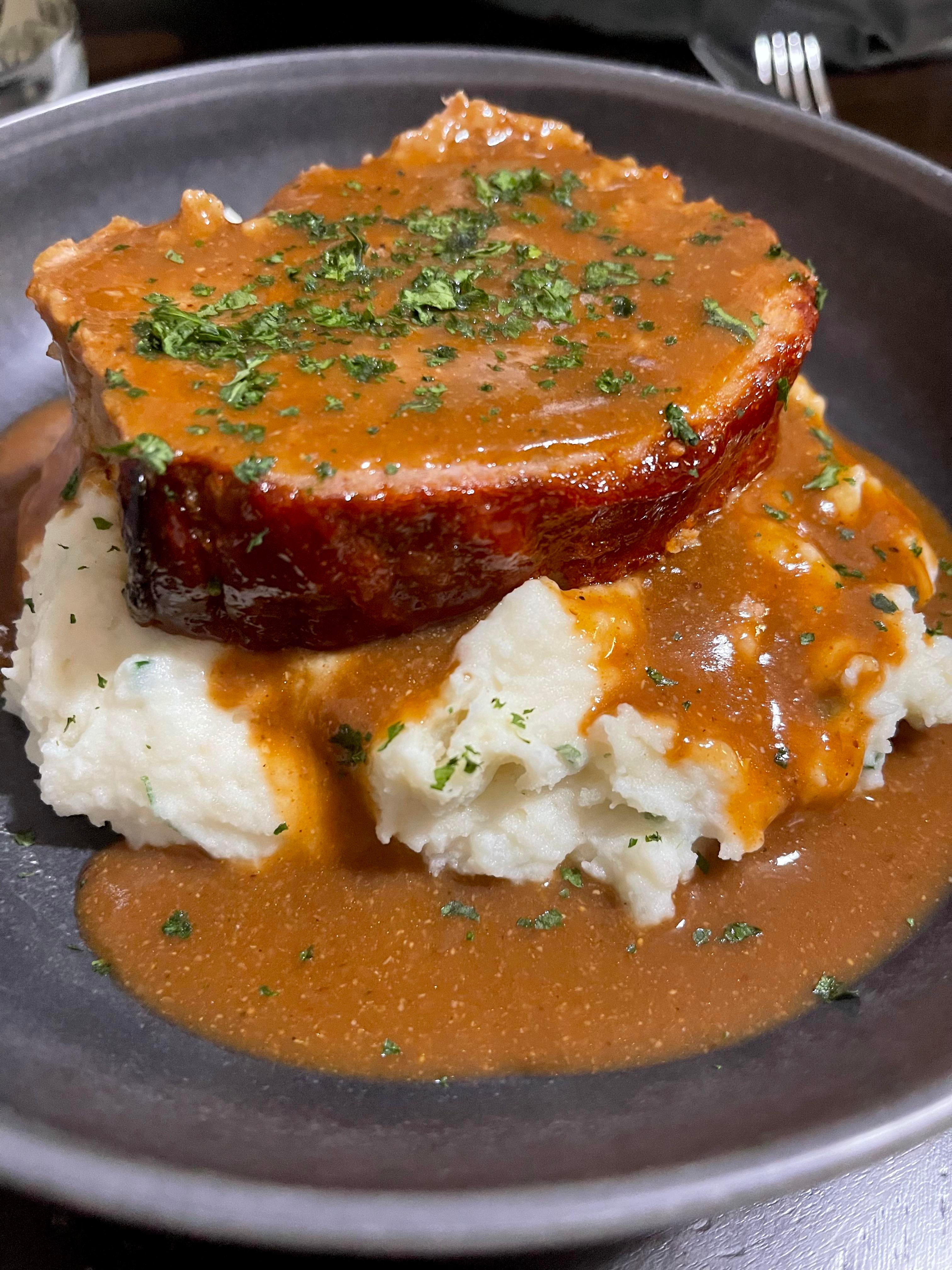 homemade meatloaf with mashed potatoes and gravy