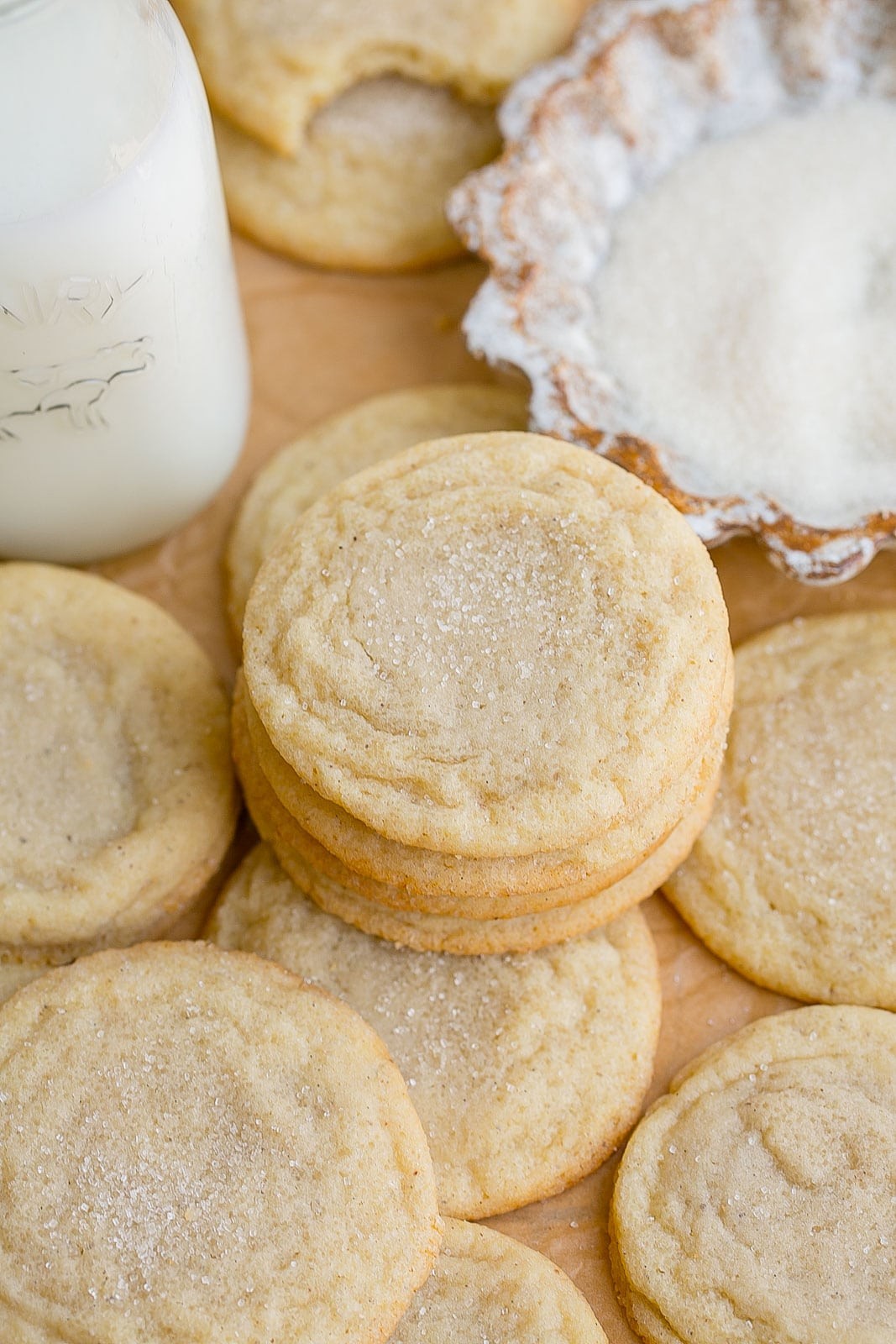 Close-up of baked sugar cookies with visible vanilla bean specks on a cooling rack, natural light