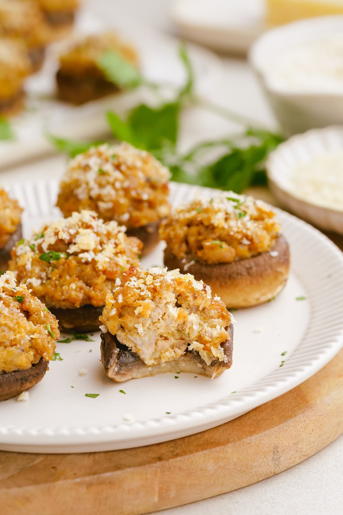 gourmet sausage stuffed mushrooms with a golden herb crust on a serving platter