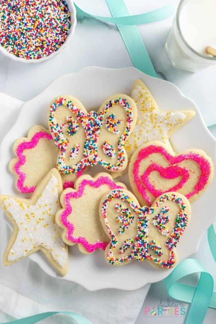 plate of perfectly decorated sprinkle sugar cookies with smooth royal icing, vibrant and appealing