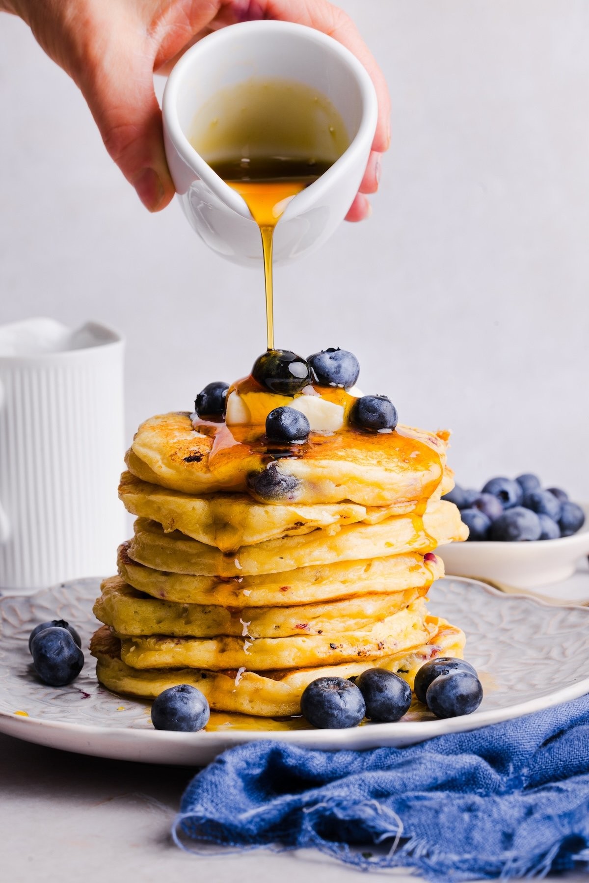 stack of blueberry cottage cheese pancakes with syrup