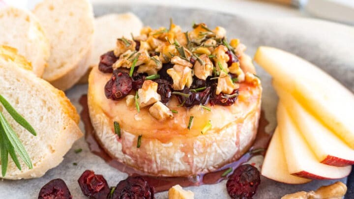 Thanksgiving Brie Honey Tart with cranberries and walnuts, rustic setting