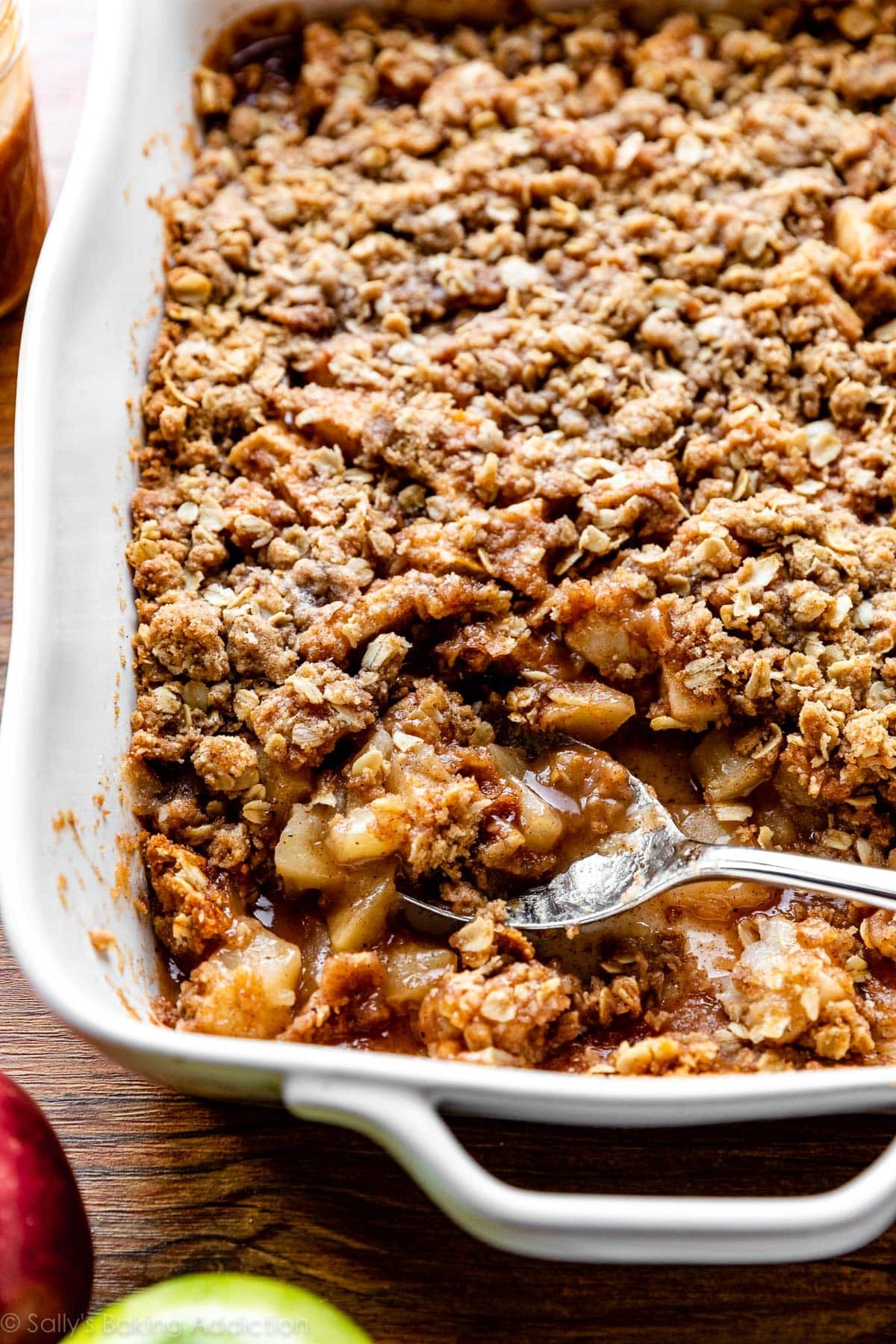 warm apple crisp with oat topping in a baking dish
