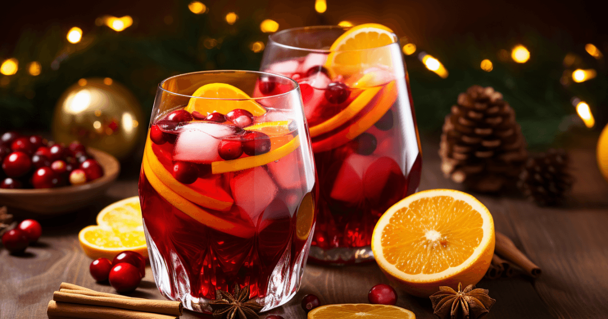 vibrant ruby sangria pitcher with festive holiday decor