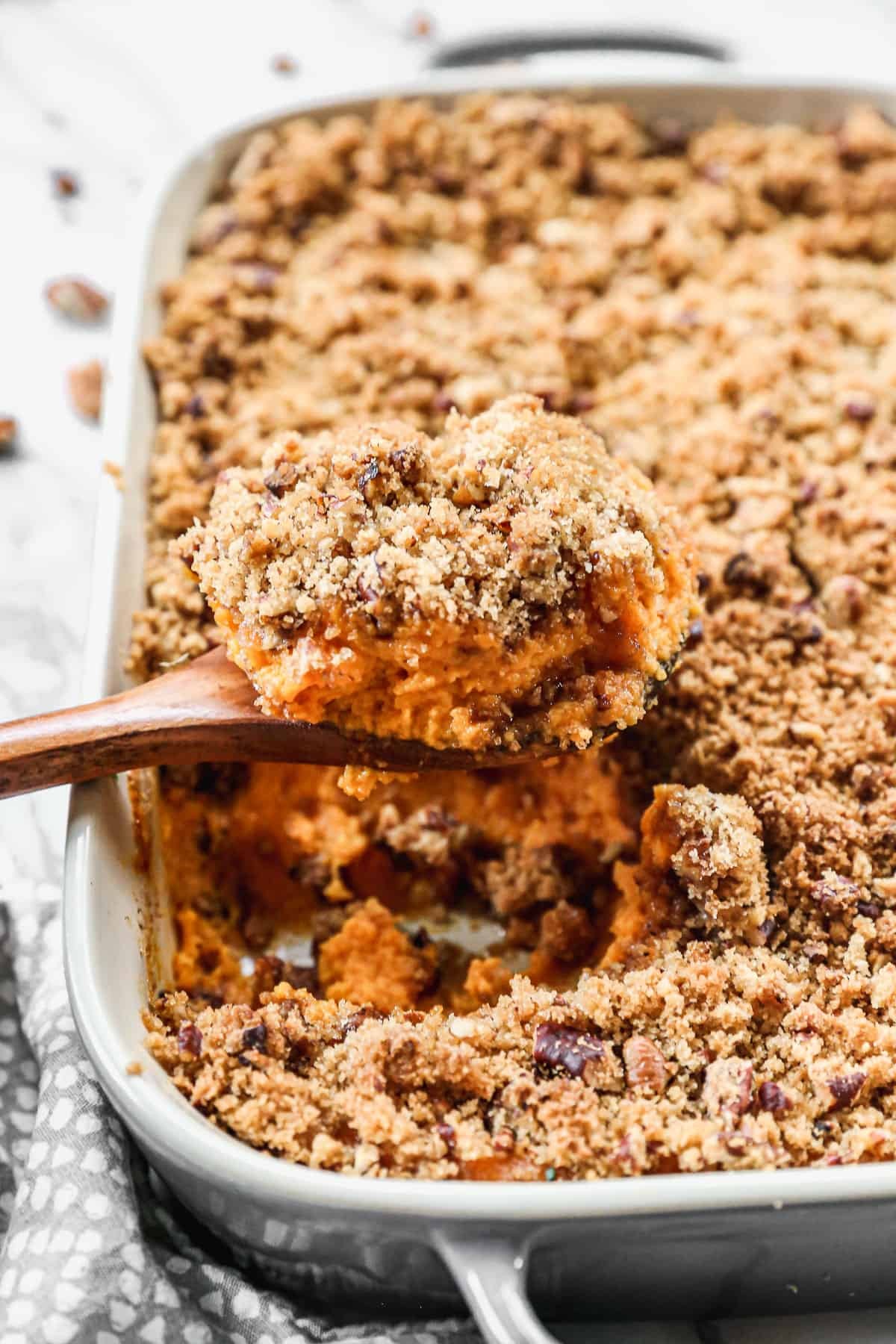 Deliciously creamy whipped sweet potato casserole with golden brown sugar pecan topping, ready for holiday table