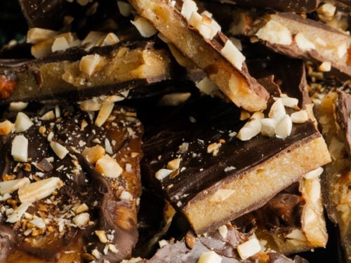 Crisp homemade almond toffee with butter crunch close-up, scattered with sea salt
