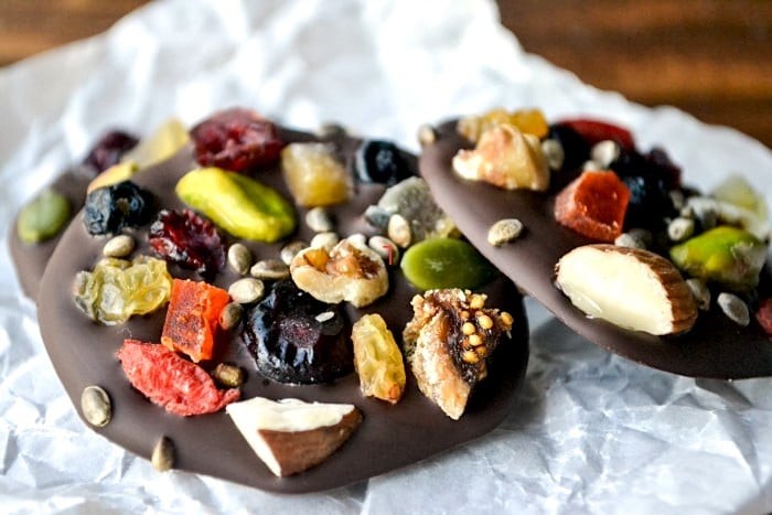 dark chocolate mendiants with various dried fruits and nuts