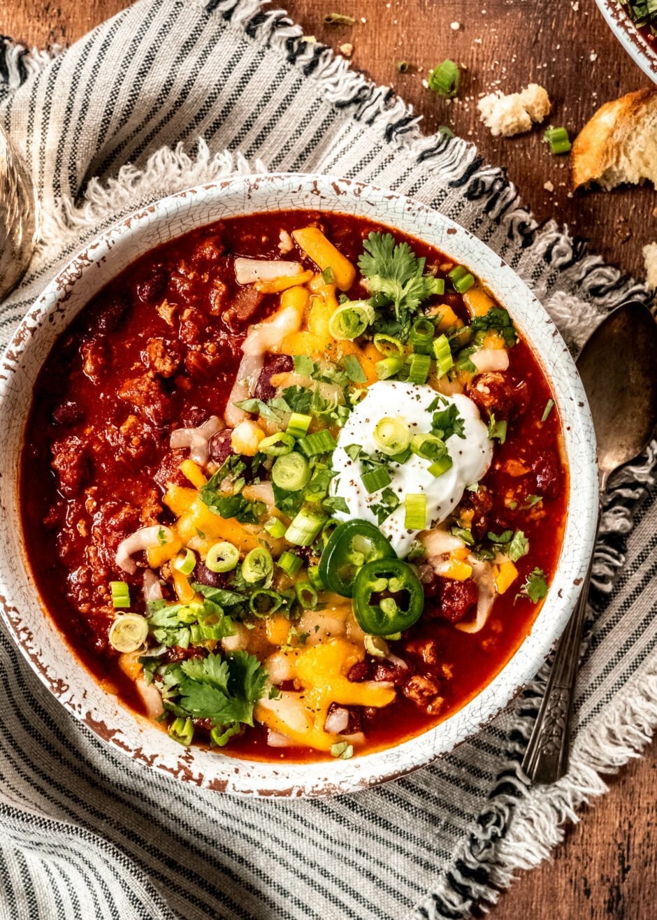 bowl of lavender and rosemary chili garnished with fresh herbs