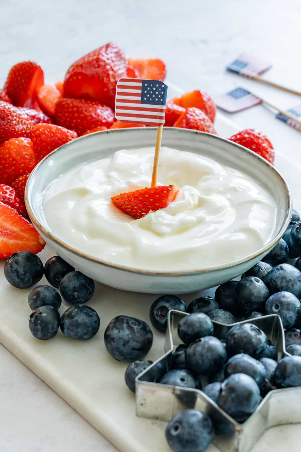 American flag fruit dip with strawberries and blueberries