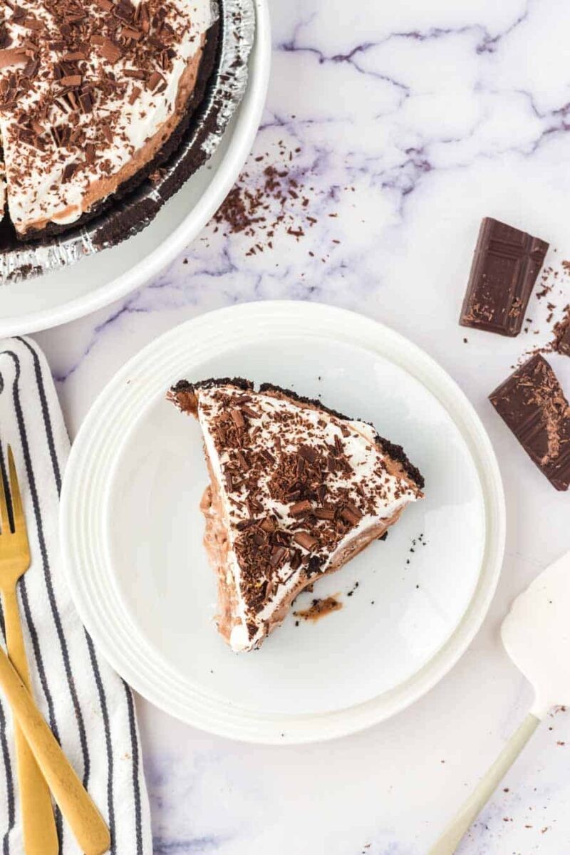 Decadent chocolate silk pie with a shiny, reflective glaze, close-up, elegant plating