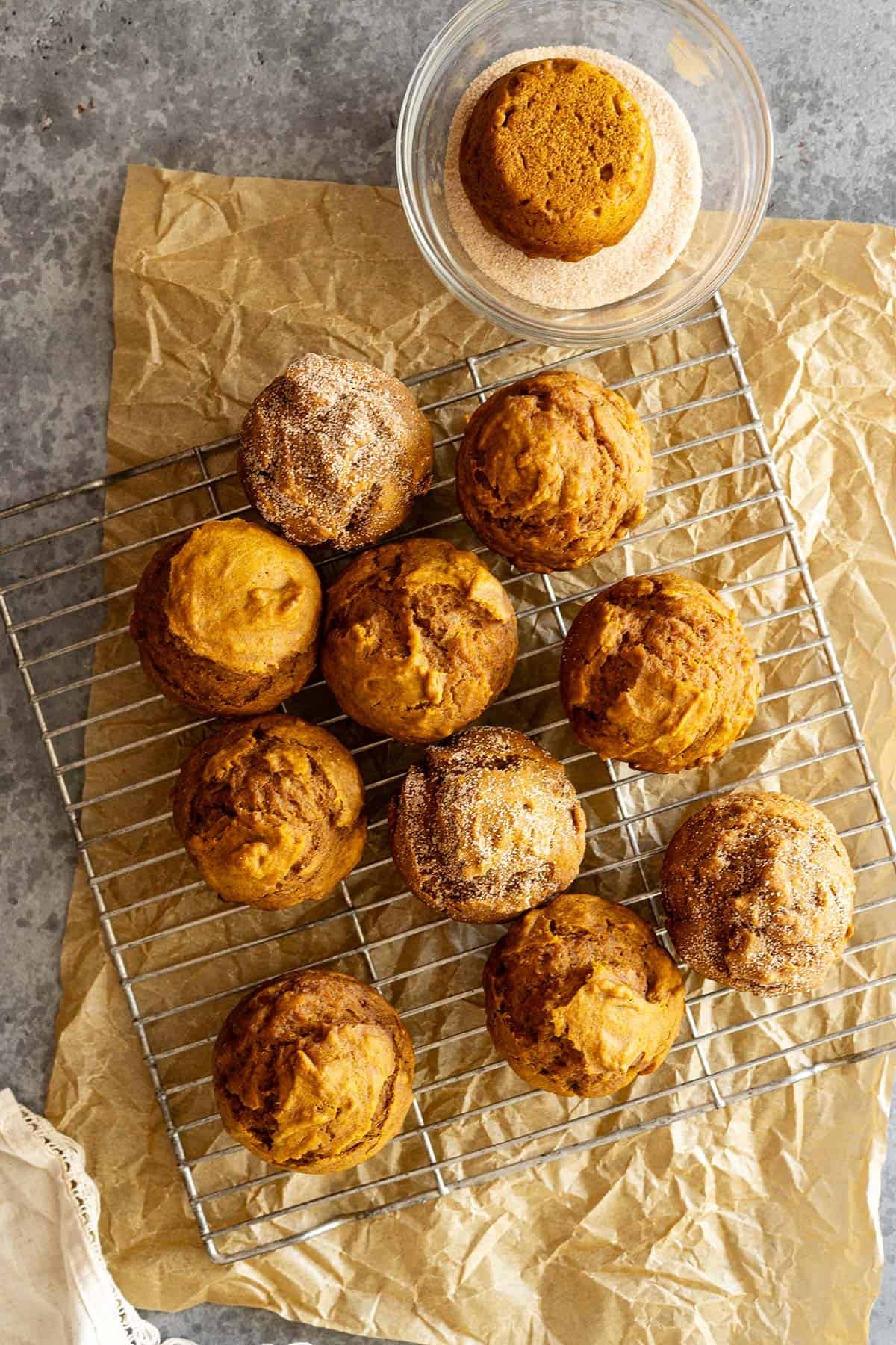 overhead shot of freshly baked pumpkin spice muffins with a dusting of cinnamon