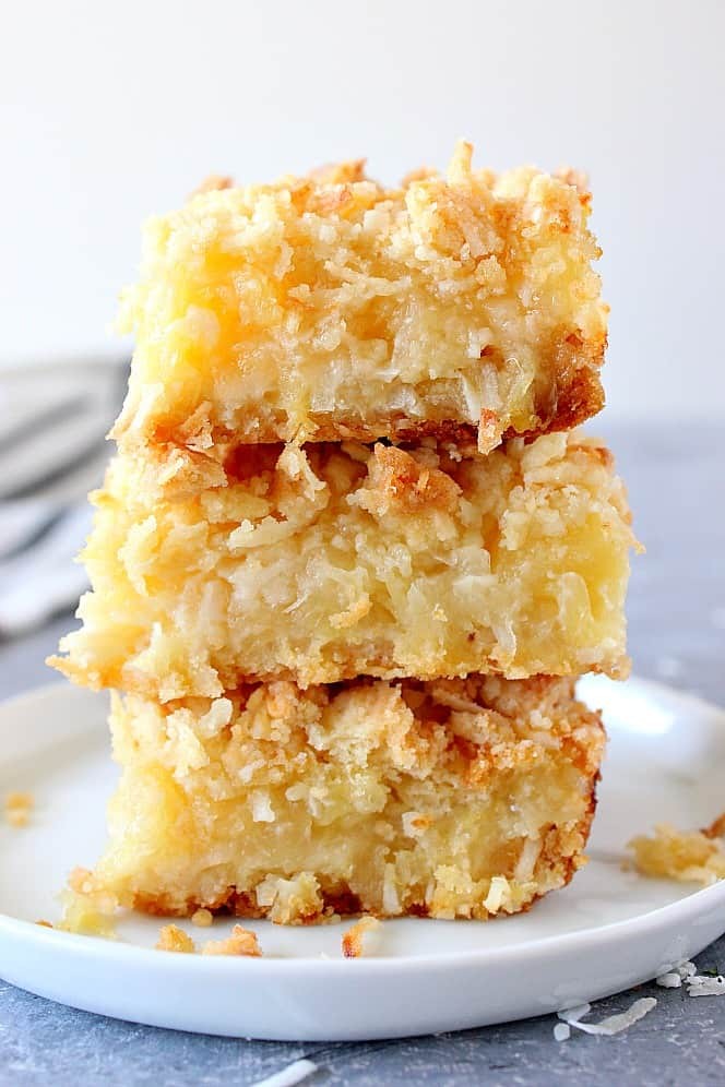 slices of pineapple coconut dream bars on a plate