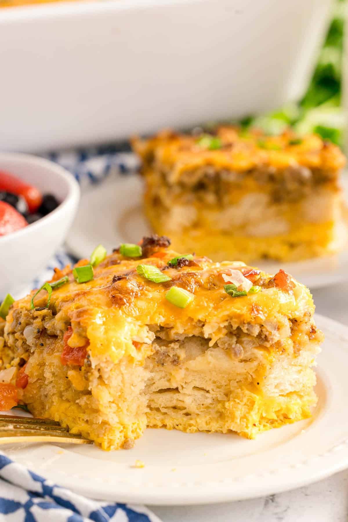Golden brown sunrise biscuit breakfast bake with melted cheese and herbs