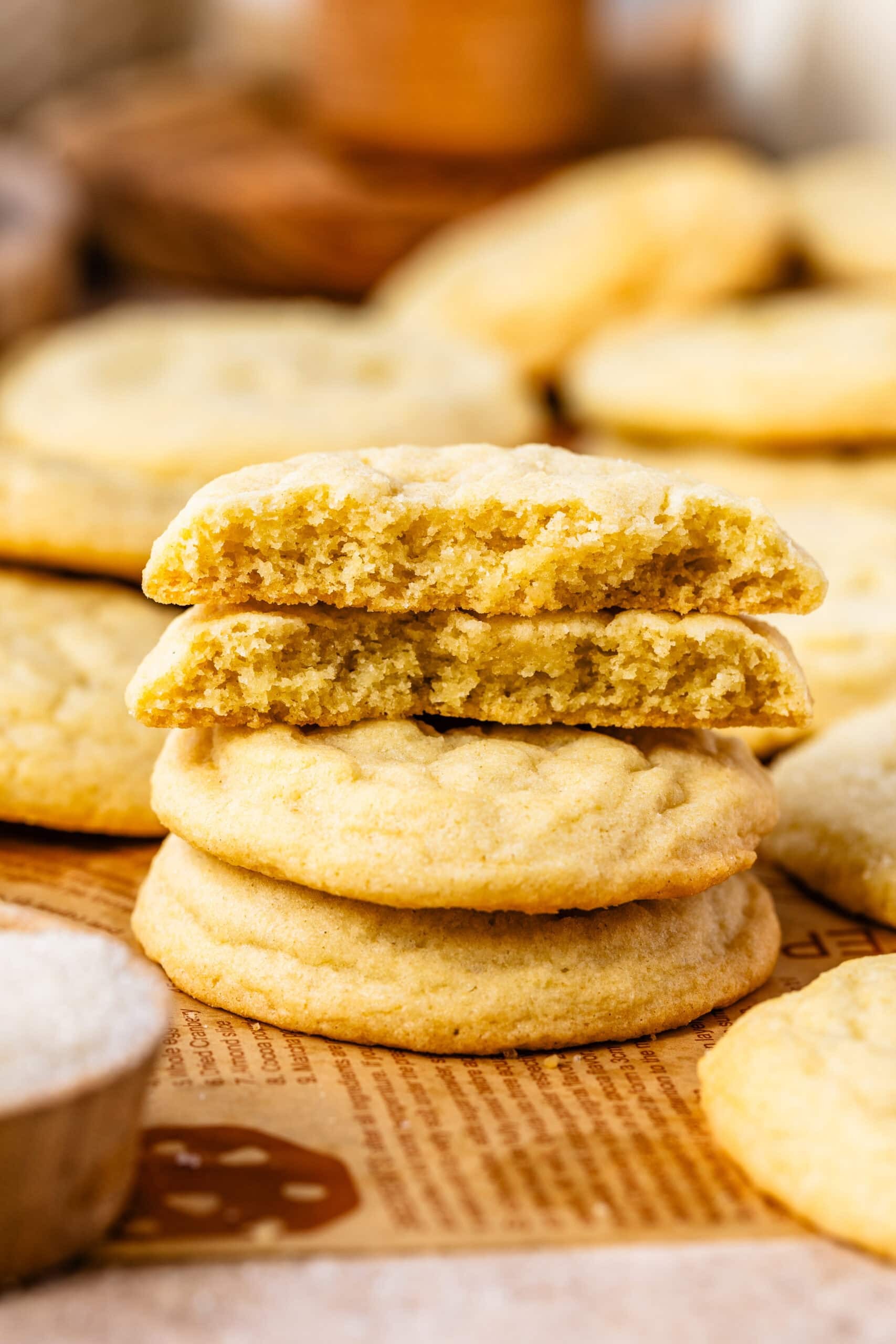 Homemade sugar cookies with a golden vanilla crumb topping, on a cooling rack, with a cozy kitchen background