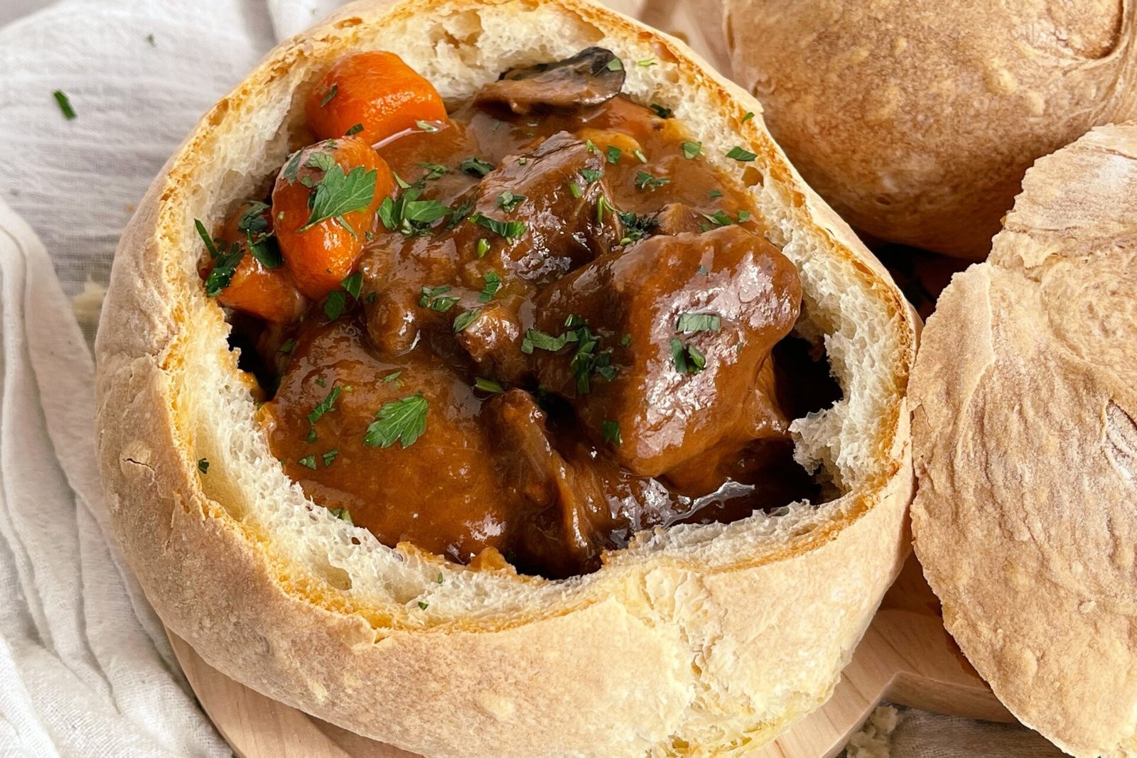 bowl of comforting beef stew with rustic bread