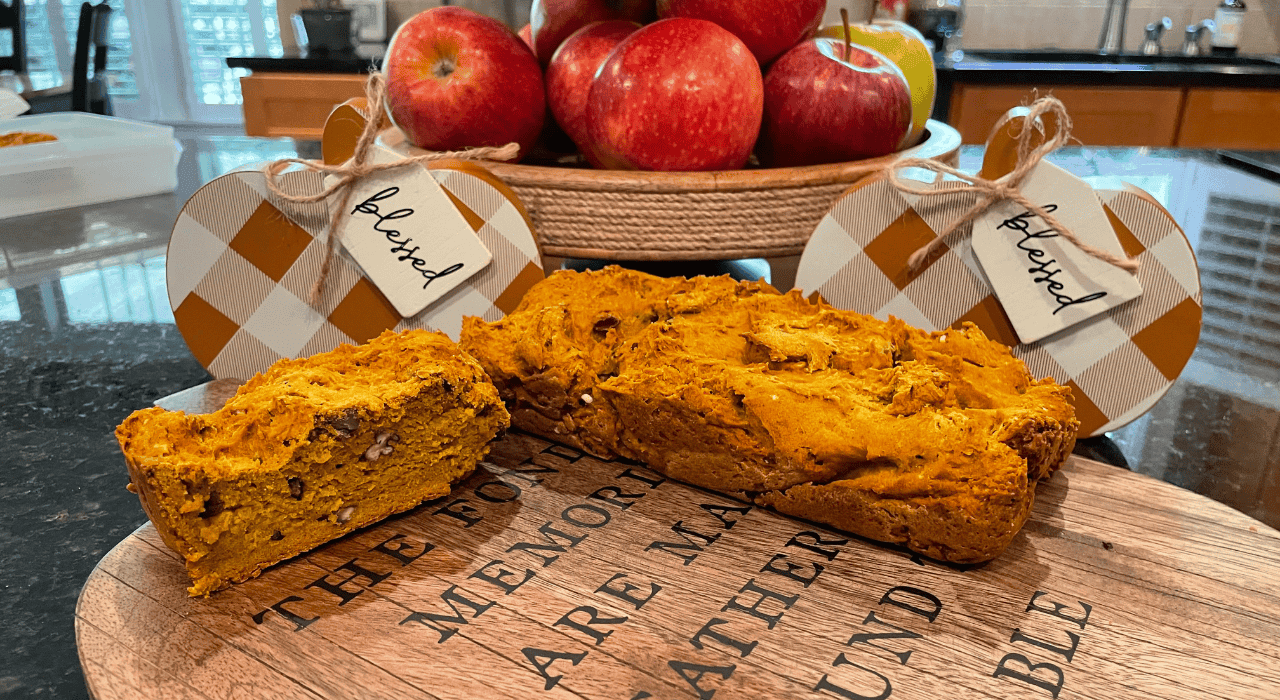 freshly baked pumpkin bread on a wooden board
