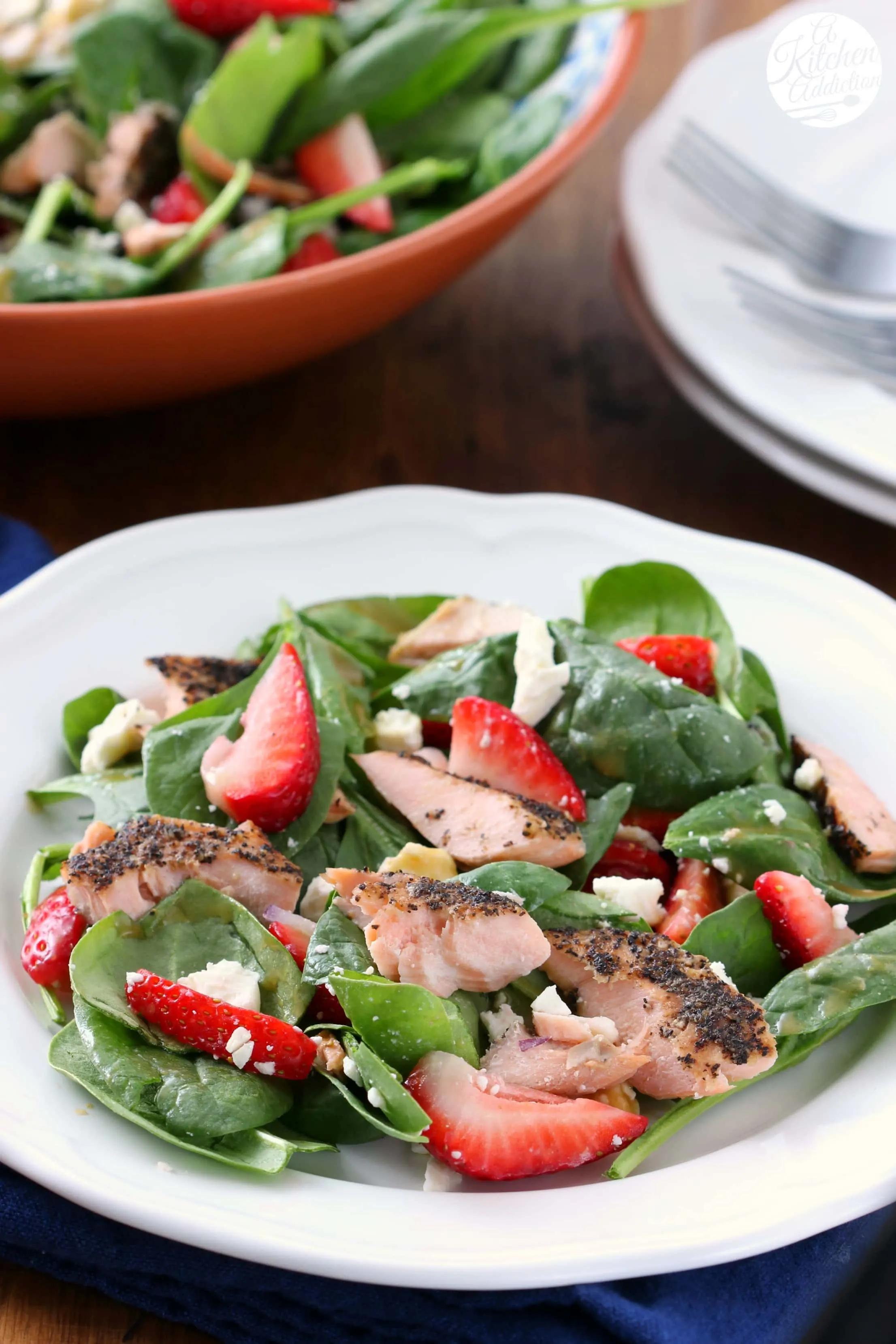 Strawberry Spinach Salad with Maple-Glazed Salmon on a plate