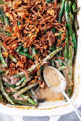 Homemade garlic crunch green bean casserole with crispy fried onions