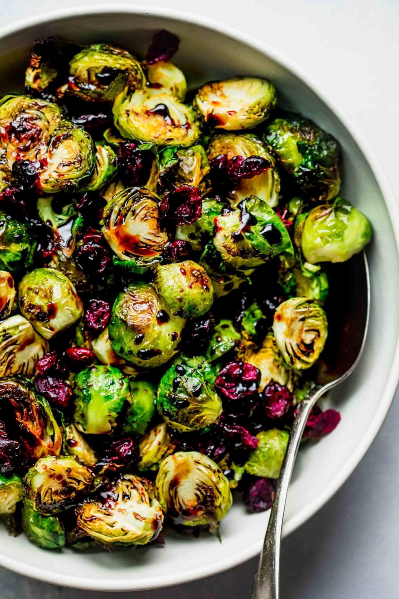 roasted brussels sprouts with balsamic glaze and cranberries on a plate